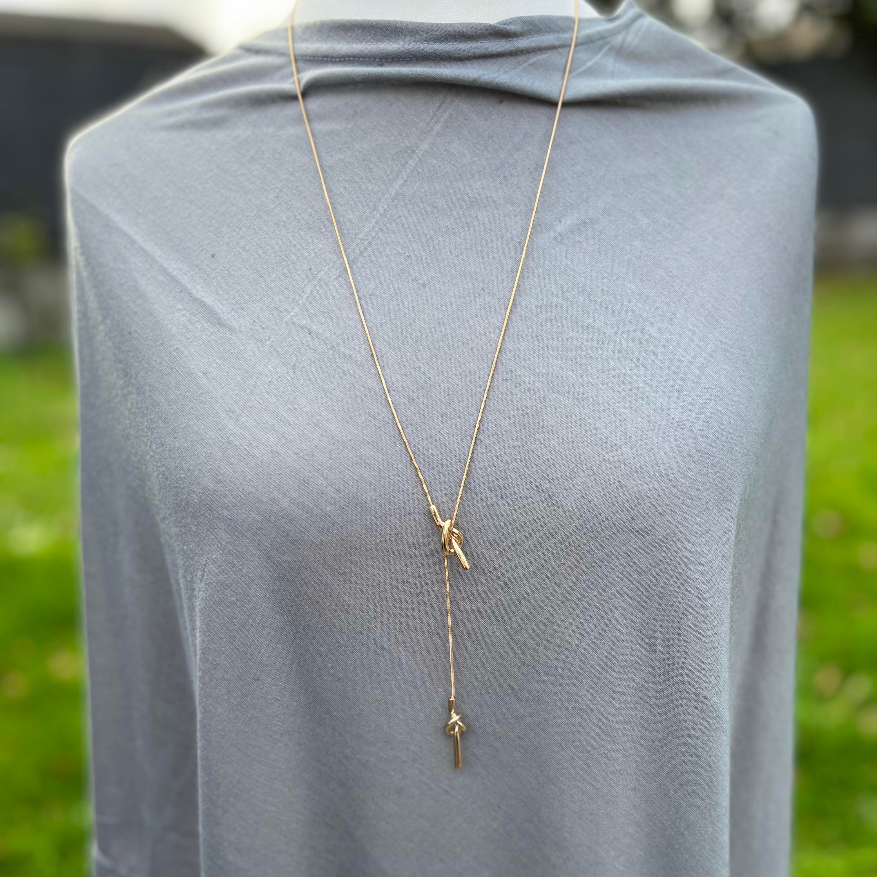 long gold knot necklace